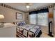 Cozy bedroom with nautical-themed bedding and window blinds at 1302 E Ashley Ave, Folly Beach, SC 29439