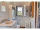 Small bathroom with pedestal sink, toilet and shower at 1302 E Ashley Ave, Folly Beach, SC 29439
