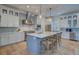 Modern kitchen with white cabinets, stainless steel appliances, and a large island at 3 38Th Ave, Isle of Palms, SC 29451