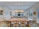 Large dining room with farmhouse table and chandelier at 3 38Th Ave, Isle of Palms, SC 29451
