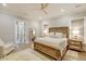 Main bedroom with a large bed, hardwood floors, and plenty of natural light at 3 38Th Ave, Isle of Palms, SC 29451