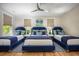 Bedroom with three twin beds and blue upholstered headboards at 3 38Th Ave, Isle of Palms, SC 29451