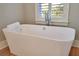 Luxurious bathroom with a large, freestanding bathtub at 3 38Th Ave, Isle of Palms, SC 29451
