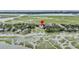 Aerial view showing property location near water, with surrounding neighborhood visible at 202 Mariners Cay Dr, Folly Beach, SC 29439