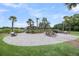 Brick patio with gazebo, fire pit, and seating area, perfect for outdoor entertaining at 202 Mariners Cay Dr, Folly Beach, SC 29439
