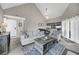 Open-concept living room with high ceilings and a view into the kitchen area at 202 Mariners Cay Dr, Folly Beach, SC 29439