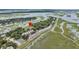 Aerial view of waterfront property with tennis courts and community pool at 202 Mariners Cay Dr, Folly Beach, SC 29439