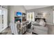 Cozy living room with fireplace and large windows offering natural light at 202 Mariners Cay Dr, Folly Beach, SC 29439