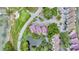 Aerial view of the property, highlighting its location near a pond and parking area at 202 Mariners Cay Dr, Folly Beach, SC 29439