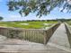 Expansive wooden deck offering serene views of marsh and waterway at 202 Mariners Cay Dr, Folly Beach, SC 29439