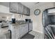 Well-equipped kitchen with light wood cabinets and stainless steel appliances at 202 Mariners Cay Dr, Folly Beach, SC 29439