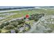 Property location highlighted in an aerial view, showcasing nearby water and houses at 202 Mariners Cay Dr, Folly Beach, SC 29439