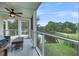 Spacious screened porch with wicker furniture, ceiling fan and peaceful water views at 202 Mariners Cay Dr, Folly Beach, SC 29439