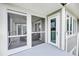 Private balcony with a screened-in section and access from the living area at 202 Mariners Cay Dr, Folly Beach, SC 29439