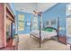 Spacious bedroom with a king-size bed, large windows, and a ceiling fan at 802 Long Drive Rd, Summerville, SC 29485