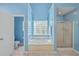 Bathroom boasts a large jacuzzi tub, walk-in shower, and marble flooring at 802 Long Drive Rd, Summerville, SC 29485