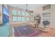 Living room features hardwood floors, a fireplace, built-in shelving, and a large TV at 802 Long Drive Rd, Summerville, SC 29485