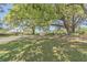 Picturesque street lined with large oak trees and a charming house at 802 Long Drive Rd, Summerville, SC 29485