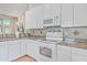 White kitchen cabinets and granite countertops at 802 Long Drive Rd, Summerville, SC 29485