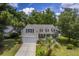 Two-story house with beige siding, and a large front yard at 802 Long Drive Rd, Summerville, SC 29485