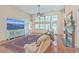 Spacious living room with hardwood floors, large windows, fireplace, and comfortable seating at 802 Long Drive Rd, Summerville, SC 29485