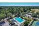Community pool, tennis courts, and parking areas are shown in this aerial view at 802 Long Drive Rd, Summerville, SC 29485