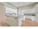 Kitchen with white cabinets, granite countertops, and hardwood floors at 802 Long Drive Rd, Summerville, SC 29485