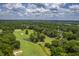 Aerial view of a golf course surrounded by lush green trees at 802 Long Drive Rd, Summerville, SC 29485