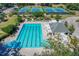Community lap pool, adjacent lounge chairs, and tennis courts visible from above at 802 Long Drive Rd, Summerville, SC 29485