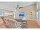 Open concept living room with hardwood floors, comfortable seating, and a large TV at 802 Long Drive Rd, Summerville, SC 29485