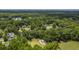 Aerial view of a neighborhood with houses nestled among lush trees and a golf course at 802 Long Drive Rd, Summerville, SC 29485