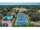 Aerial view of community tennis courts and pool with clubhouse in the background at 802 Long Drive Rd, Summerville, SC 29485