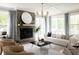 Bright living room with fireplace and large windows at 1056 Capersview Ct, Awendaw, SC 29429