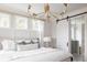 Main bedroom with sliding barn door to en-suite bathroom at 1056 Capersview Ct, Awendaw, SC 29429