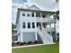 Three-story home with white siding and gray accents at 1056 Capersview Ct, Awendaw, SC 29429