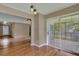 Dining area with hardwood floors and access to the living room and screened porch at 8300 Berringer Bluff Dr, Charleston, SC 29418