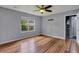 Bedroom with hardwood floors and large window, offering ample natural light at 8300 Berringer Bluff Dr, Charleston, SC 29418