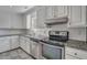 Modern kitchen with white cabinets and granite counters at 8300 Berringer Bluff Dr, Charleston, SC 29418