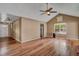 Hardwood floor living room with vaulted ceiling and access to front door at 8300 Berringer Bluff Dr, Charleston, SC 29418