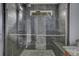 Large walk-in shower with pebble tile and bench at 8300 Berringer Bluff Dr, Charleston, SC 29418