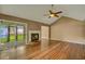 Spacious living room with hardwood floors, fireplace, and access to backyard at 8300 Berringer Bluff Dr, Charleston, SC 29418