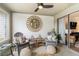 Relaxing sunroom, featuring two armchairs and access to the back of the house at 1647 Live Oak Park, Seabrook Island, SC 29455