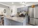 Modern kitchen with granite island and stainless steel appliances at 1647 Live Oak Park, Seabrook Island, SC 29455