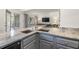 Modern kitchen with gray cabinets and granite countertops at 1647 Live Oak Park, Seabrook Island, SC 29455