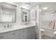 Elegant bathroom with double vanity, marble countertops, and a shower/tub combo at 1647 Live Oak Park, Seabrook Island, SC 29455
