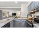 Modern kitchen with granite countertops and stainless steel appliances at 1647 Live Oak Park, Seabrook Island, SC 29455