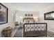 Charming bedroom with a comfortable bed, accent chair and large artwork at 1647 Live Oak Park, Seabrook Island, SC 29455