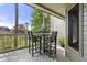 Deck with patio furniture and umbrella, overlooking nature at 1647 Live Oak Park, Seabrook Island, SC 29455