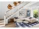 Comfortable living room featuring a sectional sofa and natural light at 3115 Ion Ave # A, Sullivans Island, SC 29482