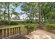 Deck and backyard with mature trees and shrubs at 257 Savannah Round, Summerville, SC 29485